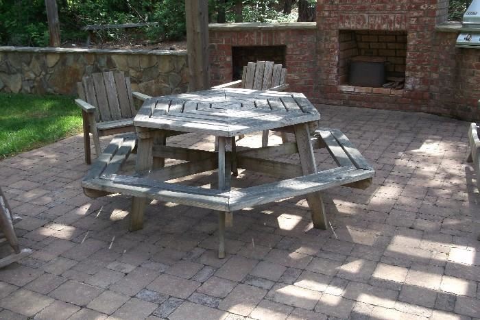 Octagonal picnic table and matching Adirondack chairs.