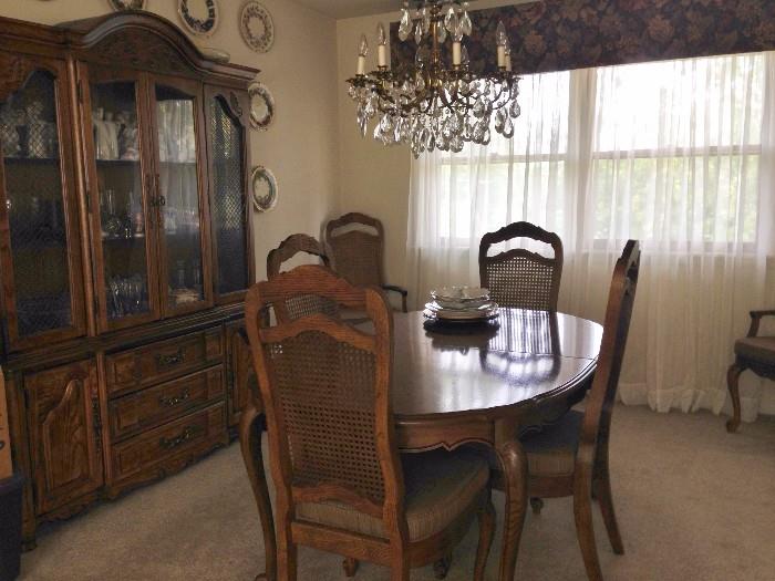 Bernhardt dining set of oval table with 2 leaves and pads, 2 host and 4 side chairs,  and large breakfront with silverware drawer
