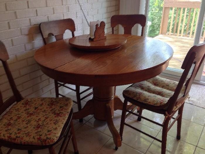 Antique oak pedestal table and 4 antique oak chairs