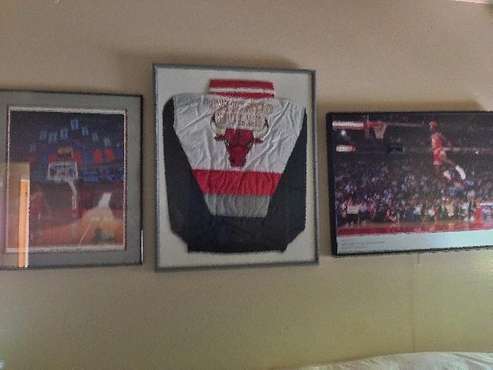 Another photo of same Autographed Michael Jordan jacket with  MJ framed pictures