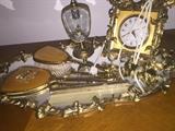 Dresser set includes clock. Mirror. Perfume. Brush comb and hand held mirror 