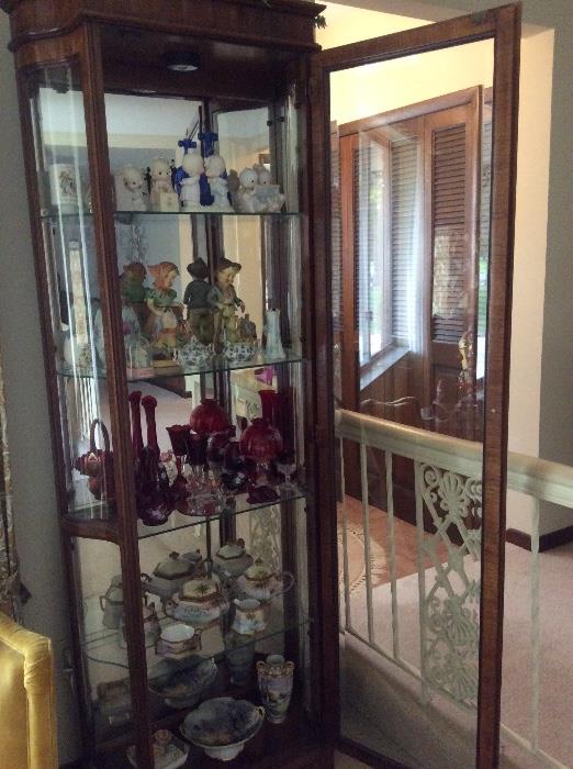 Collectible figurines, glass display cabinet