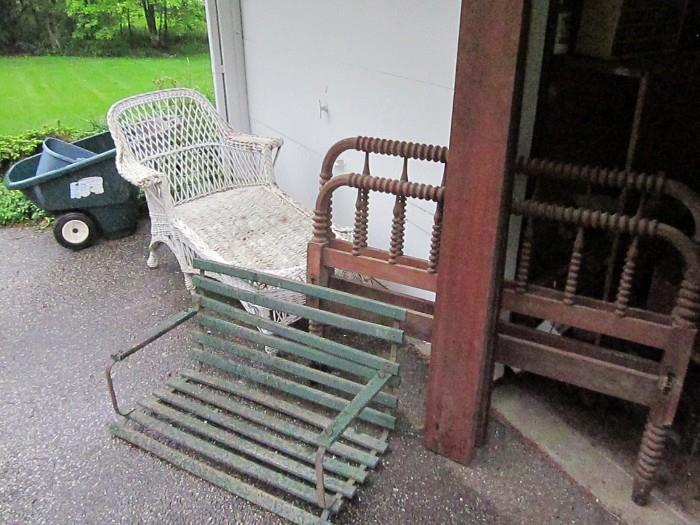 Wicker day bed, walnut Jenny Lind bed, small porch swing and yard cart.