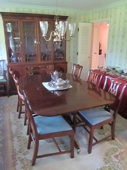 Inlaid mahogany dining room by Hickory Chair Co. from Sedlaks. China Cabinet, table with two leaves and eight chairs. 