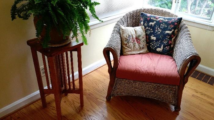 solid oak arts & crafts style plant stand/ side table....wicker chair...needlepoint pillows