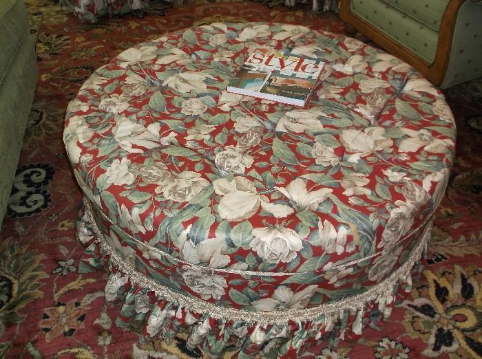 Large round upholstered ottoman w/tufted top