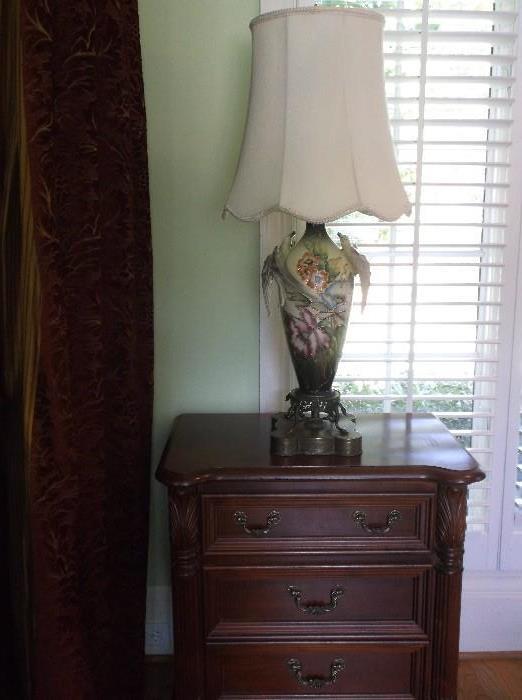 One of a pair of three drawer  bedside tables