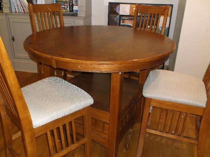 Oak mission style table w/extension and four chairs