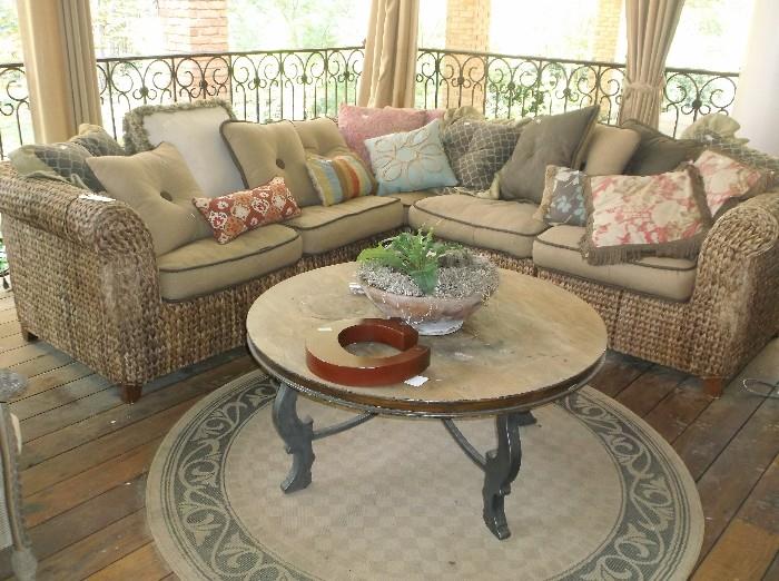 Rattan sectional sofa and round coffee table