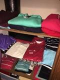 Clothes stacked up like a Nordstroms -- Nautica, Abercrombie, Old Navy, Chas, L.L. Bean, J. Crew, Hilfiger -- Most never worn -- that red sweater, top right? Cashmere.