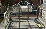 Pretty white wrought iron bed with springs