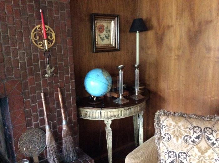 Antique globe, candlesticks, pair of console tables