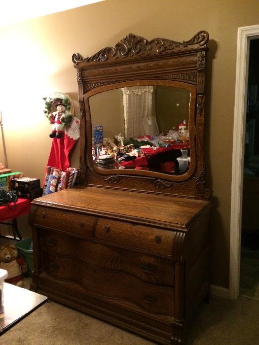 Over 100 years old.  Antique oak dresser.  Mirror is almost perfect.  Gorgeous piece of history.