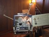 Bell & Howell 16mm film projector with speaker.
