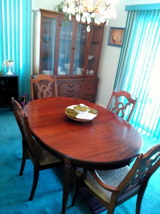 Nice dining room suite.  8 chairs total, 2 leaves for the table.  Matching china cabinet and side board / buffet.
