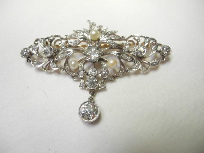 Nearly 5 1/2 carats of Diamonds with 1.53 ct center stone and 1 ct. dangler. Written Professional appraisal at $39,000 included. Starts at $12,000