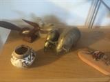 Horse hair pottery, wood roadrunner, marble dove, brass armadillos