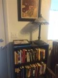 Pinot noir print, books, bookshelf, lamp