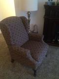 Reclining armchair, tall etched brass lamp