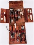 Lot #257, Vintage WWI German Military Multi Tool Kit
Vintage multi tool kit with interchangeable tool heads including screw drivers, files, a hammer, knife blades, picks, and a corkscrew, all that fit into a single handle. Kit also includes 3 pair of pliers. All are nestled into a folding leather pouch. There are no manufacturing marks on the tools or the pouch but they appear to be German made and were possibly used by the military during WWI. Handwriting inside the front flap reads, "F.S. Wiemeyer - St Louis, MO". Shows some wear in the leather pouch and minor oxidation on the steel tools. When folded measures 6" x 5.5" x 1.5". Tag Words: Militaria