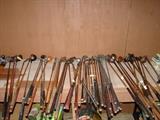 Antique golf clubs - wooden handles on a lot of them