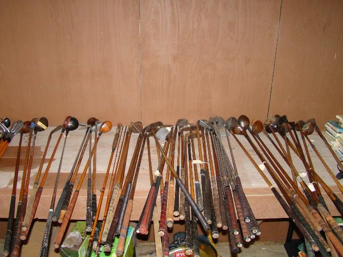 Antique golf clubs - wooden handles on a lot of them