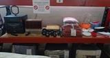 Stereo system, VCR, various dumbbell weights, pillows, towels