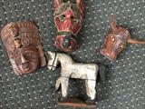 Various masks and figurines primarily from Latin America