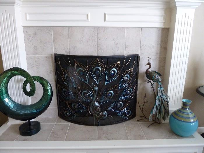 Peacock fireplace screen, turquoise pottery, peacock metal art