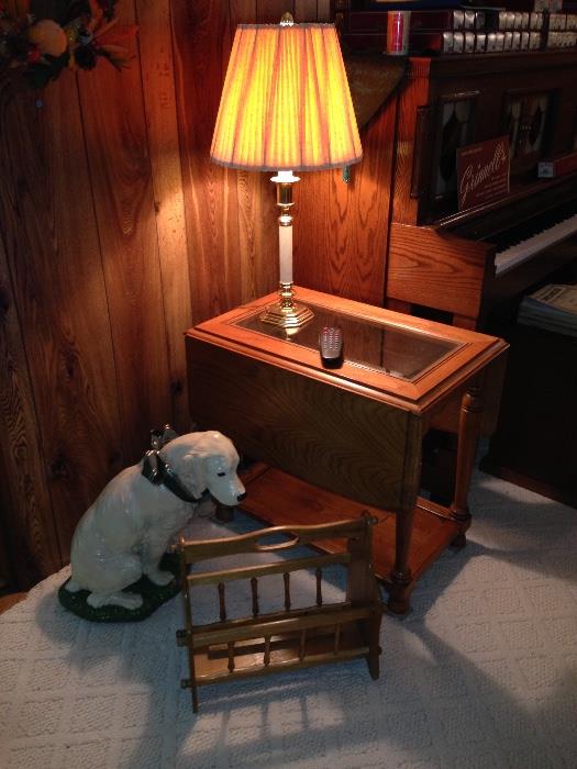 Drop side Oak table with glass insert and a cement dog