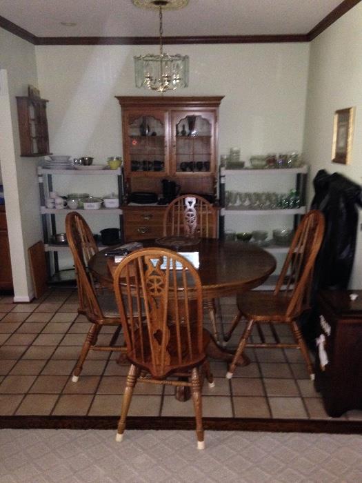 Solid Oak dining table and 4 chairs, 2 leafs, ( china cabinet is not for sale!