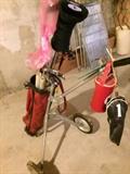 golf clubs and bag on wheels