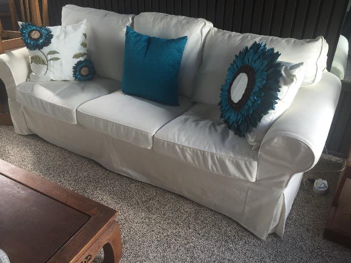 White slip-covered sofa