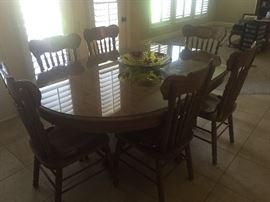 Very nice solid oak dining table and 6 chairs, thick glass protective top