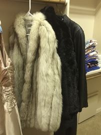 Fox Fur, has a tear in the shoulder, full length leather coat