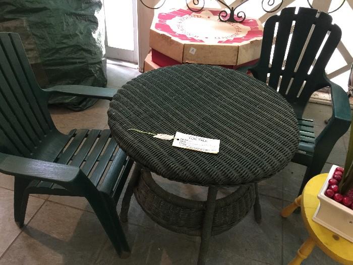 #60 Kid wicker table with 2 plastic chairs $50 —