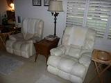 Pair of cream leather recliners and maple end table
