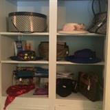 Variety of Mrs. Clapp's hats and purses