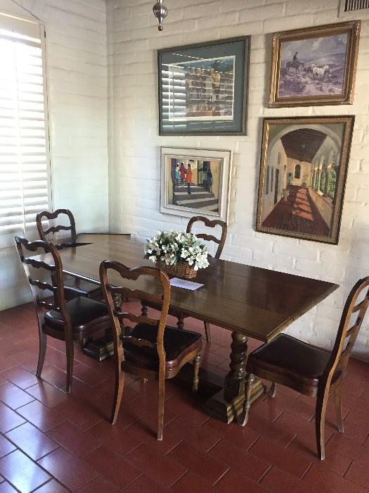 This trestle dining room table and chairs will fit any decor, so will the art!