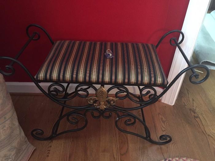 Iron bench with upholstered seat; there is about a yard of extra fabric that will sale with it