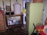 vintage wood File Cabinet,  #8 Crock, Bongo Drums and behind them is a Pyrex Glass Jar & misc.   Downstairs items