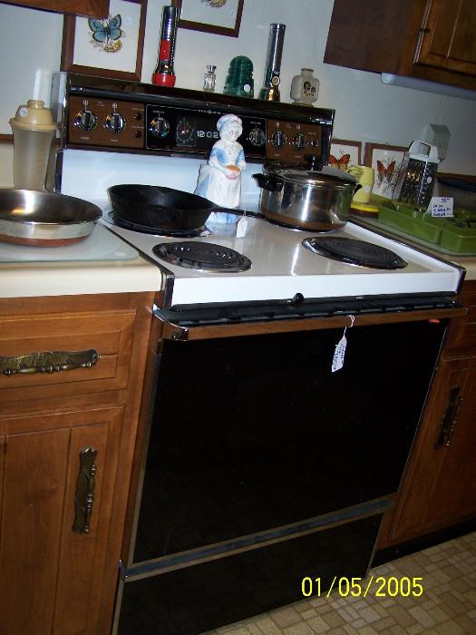 Really Nice pretty new Stove with self cleaning Oven. copper bottom Cookware, cast iron Skillets misc. Kitchen items  - Upstairs items