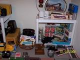 Southern Train w/5 Cars at the bottom of picture, NIB train Cars,  Cups & Glasses of Southern, misc items of Southern, Cameras, Film, Lights, two Movie Screens not shown - Upstairs items