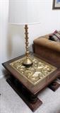 Carved gilt top end table. Spooled brass lamp