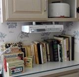 Cookbooks. Not sure if the radio is for sale