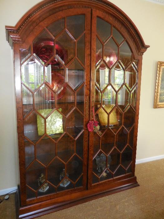 Gorgeous Burled Mahogany 7 Foot Lighted Curio Cabinet with Beveled Glass, Hand Beaded Mahogany along Arch.Opens to Shelves. 