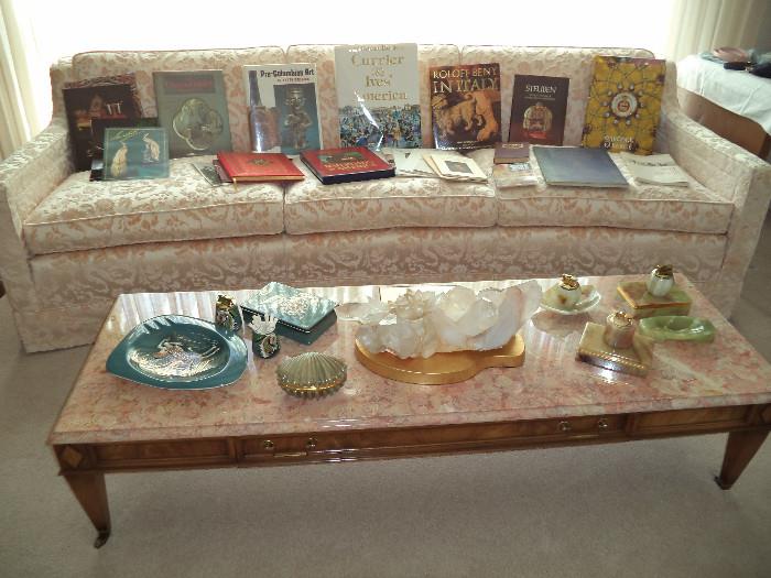 curved sofa, marble top coffee table, geode table piece, Brastoff ashtrayt set, onyx ashtray sets, books