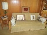 rattan sofa bed, rattan table, iron lamp