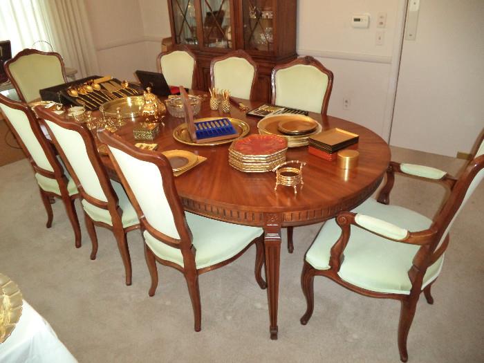 Kindel dining table w/ 8 chairs, 3 leaves & pads, 24K gold plated flatware, trays, gold gilded china, serving pieces