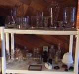 Assorted glass vases, old bottles, frosted glass light shade, flower frogs